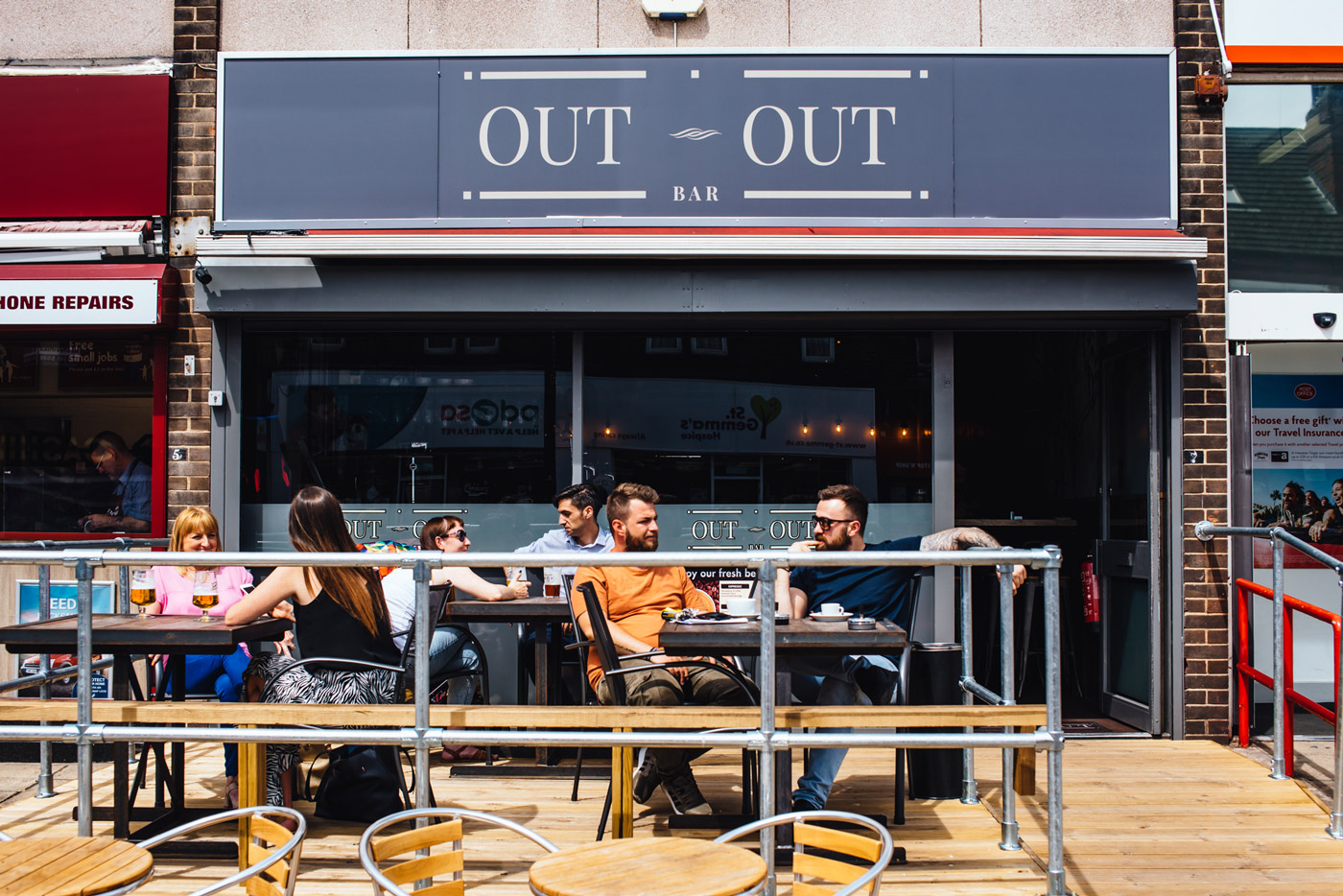 Locals enjoying a sunny after-work drink at Out Out bar.
