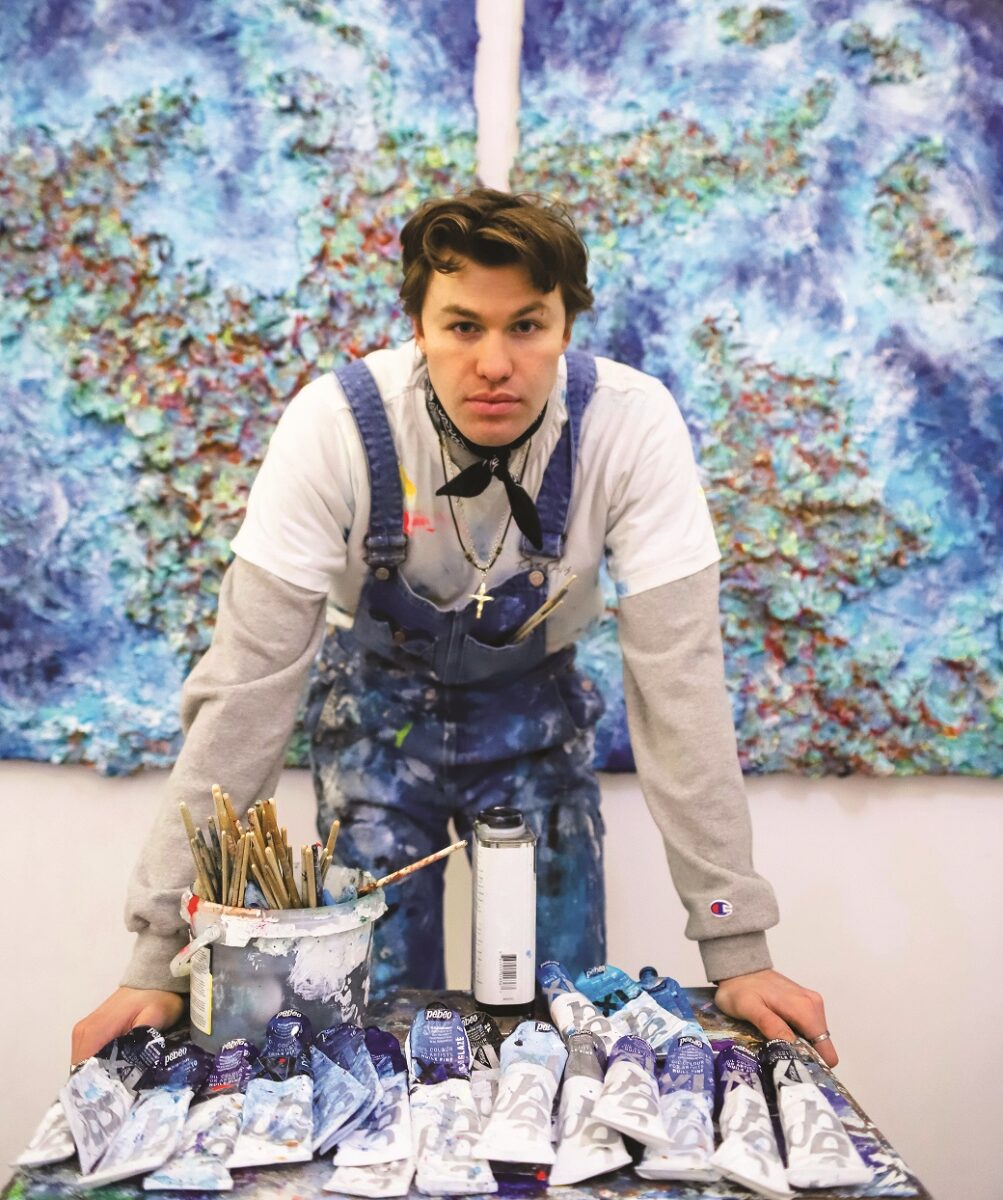 Joshua Van Leader in his studio and artwork at the Inspire to Inspire exhibition